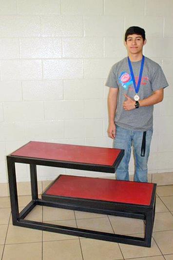 Jersey Village High School senior Edward Gonzalez poses with his project that placed first in Manufacturing Metals.